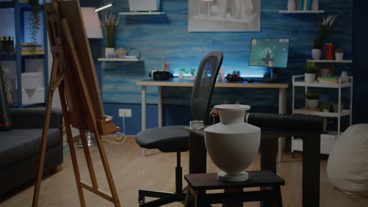 Empty artwork studio space with easel and white canvas