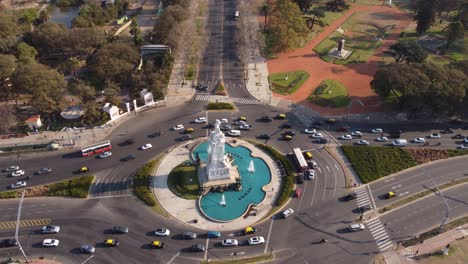 aerial flyover monument to the carta magna and four regions of argentina with traffic on road in buenos aires