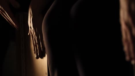 close up of hands of artists playing cajon in flamenco performance