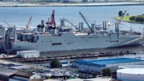 large cargo freighter ship at dock in port