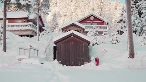 Wooden-Norwegian-Cabins-In-Snow-During-Winter-In-Indre-Fosen,-Norway