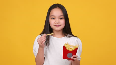 girl eating french fries