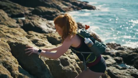 a young adventurer exploring coastal rocks: a journey through nature’s beauty and challenges along the shoreline with a scenic ocean backdrop
