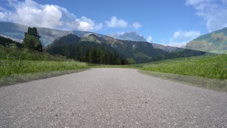 couple woman and man on electric eco bike cycling italy dolomites alps