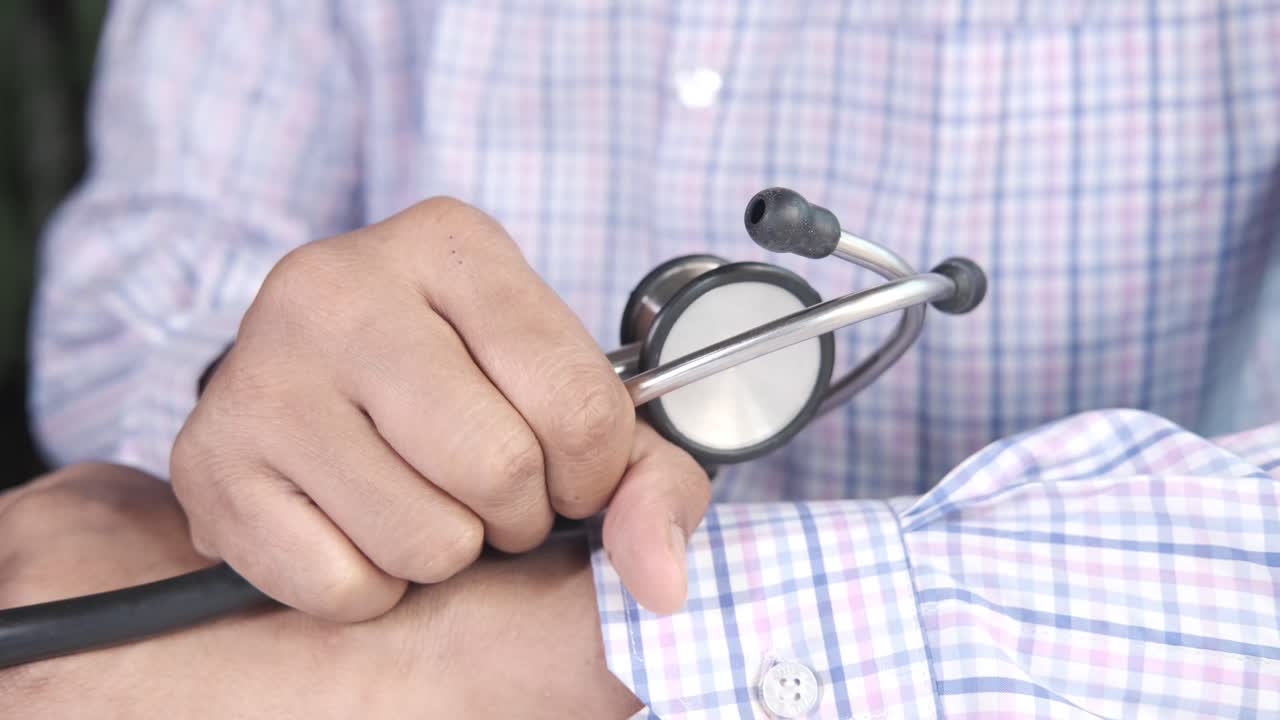 Doctor Checking Blood Pressure