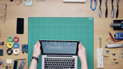 Top-view-software-engineer-hands-coding--at-desk-from-above---Red-Epic-Dragon