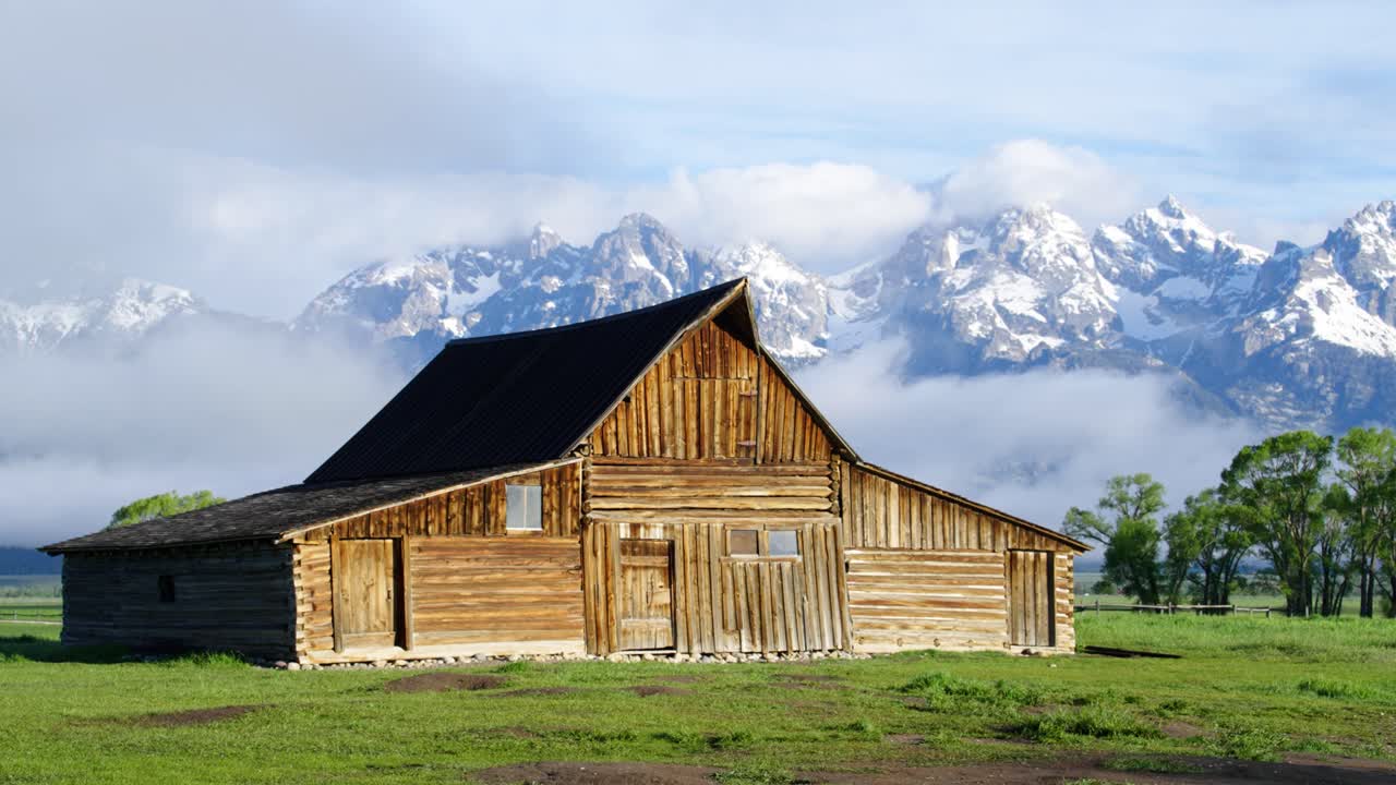 Cloudy time lapse at barn at Mormon Row in Grand Teton National Park, Wyoming
