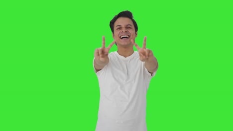 Happy-Indian-man-showing-victory-sign-Green-screen