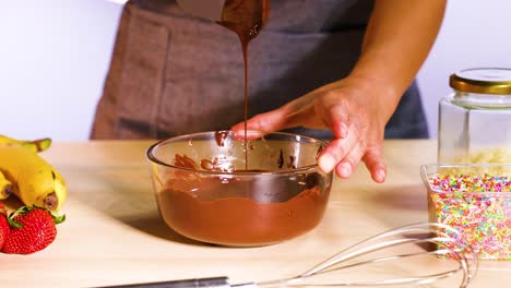 mixing chocolate with bananas and strawberries