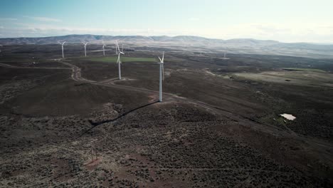 wide angle view of a large wind energy power facility in the desert, aerial panorama