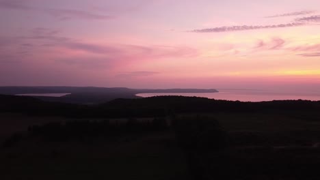 canadian wildfire gives sleeping bear dunes national lakeshore a dramatic sunset sky at pyramid point in leelanau county, michigan