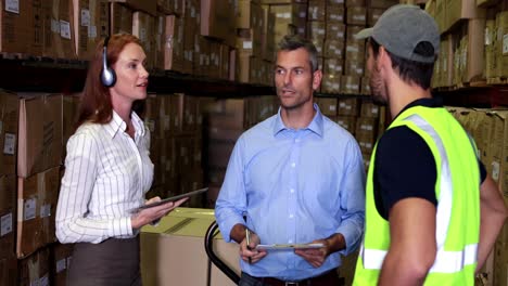 warehouse worker talking with management