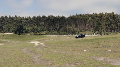 pickup truck driving across big plain in slow motion