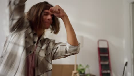 young man dancing in a room