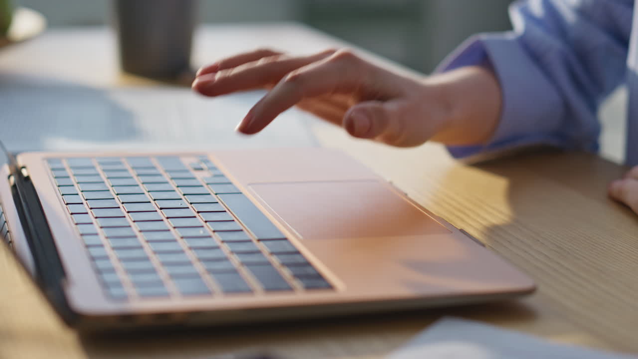 Woman hand pressing keyboard laptop turning on online webinar at home closeup