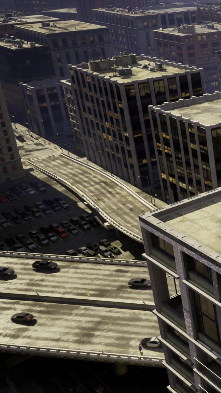 Panorama urbano da un grattacielo che mostra strade e auto parcheggiate in città.