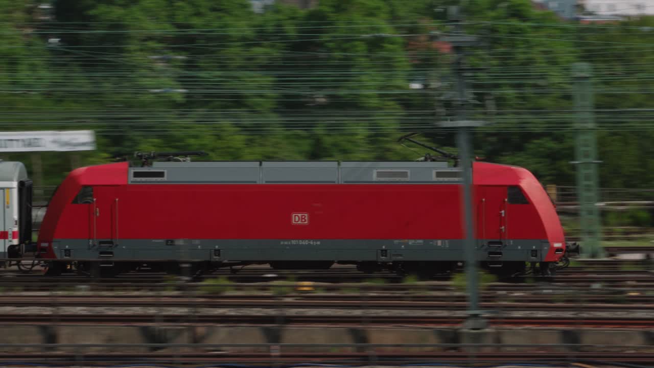 German IC diesel passenger train passing by tracked by camera close up