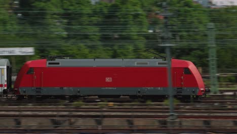 german ic diesel passenger train passing by tracked by camera close up
