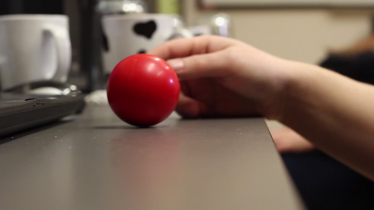bored employee playing with a balloon