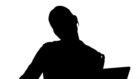 silhouette businesswoman in a good mood dance, sitting on the desk with laptop, and answer a phone call