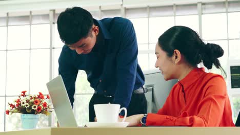 two business people talk project strategy at office