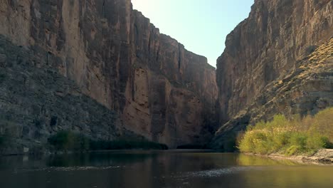 river flowing in eroded canyon cliffs landscape at big bend national park