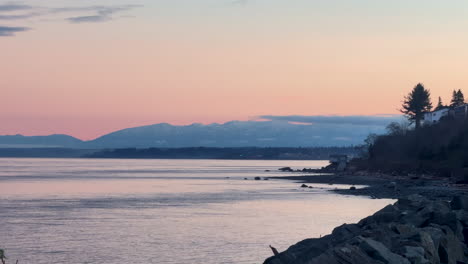 fiery sky meets calm waters at campbell river sunset.