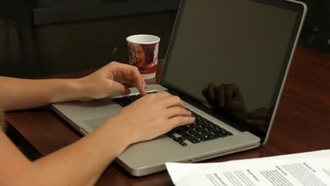 Businesswoman-working-on-her-laptop