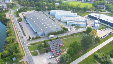 Aerial-view-of-warehouse-storages-or-industrial-factory-or-logistics-center-from-above