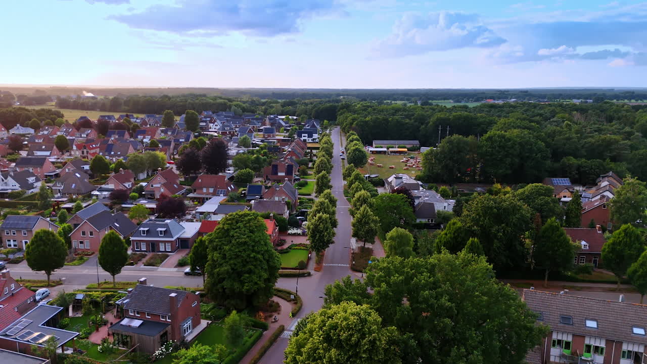 Suburban sunset view. Aerial view of a serene suburban neighborhood glowing in sunset light, highlighting trees and homes