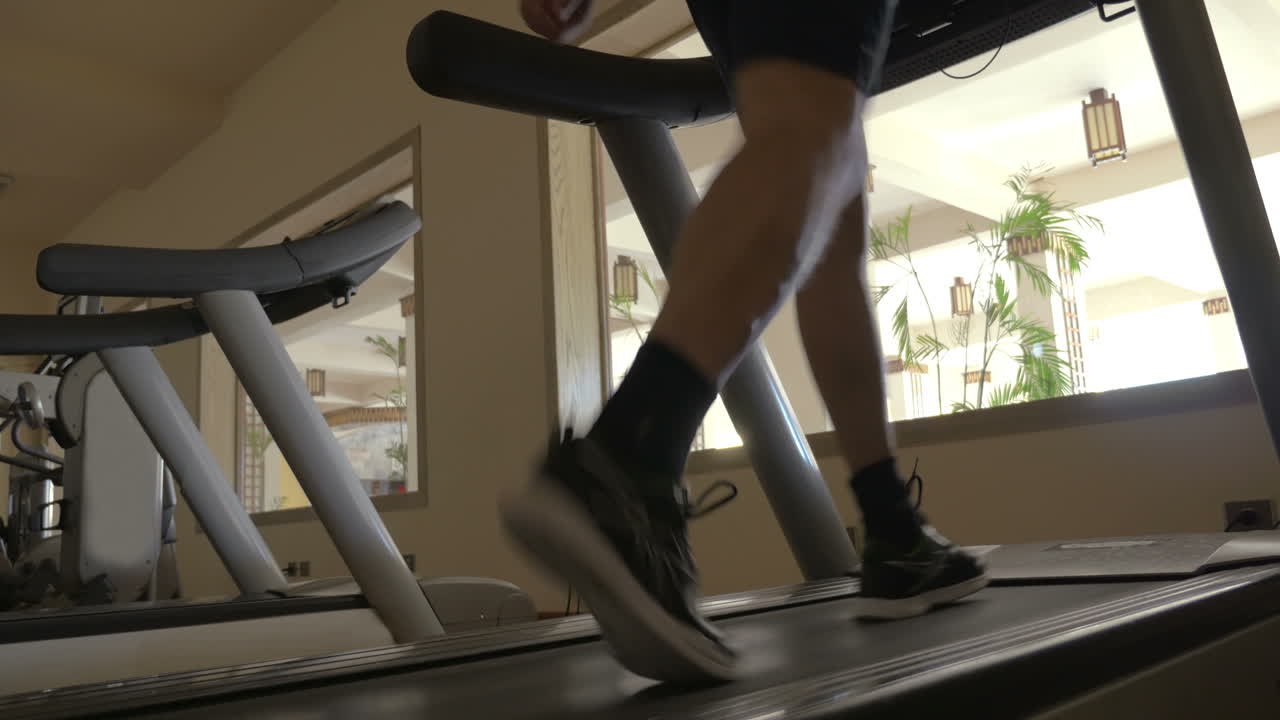 Stepping on treadmill in the gym