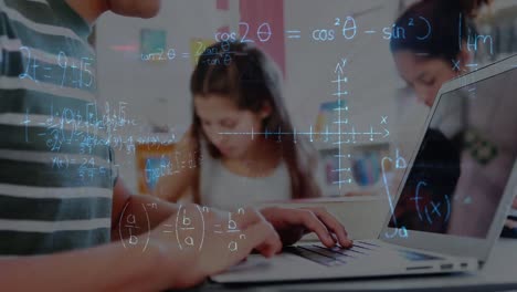 Animation of math formulas over hands of caucasian boy using laptop at school