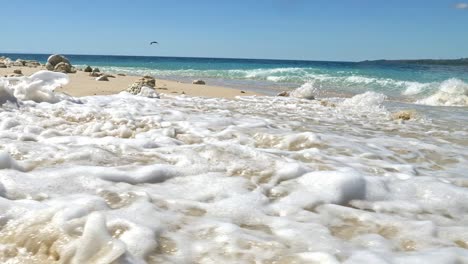 waves hitting rocks on tropical beach, nosy be, nosy fanihy, madagaskar, africa