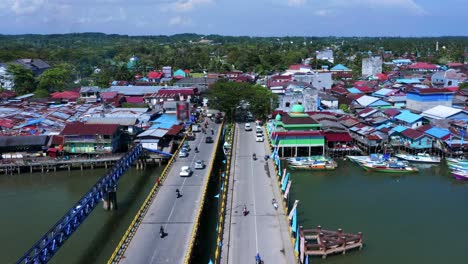 Aerial-View-Of-Cars-And-Motorcycles-Driving-Through-Jembatan-Dua-Manggar-Bridge-In-Balikpapan-Timur,-Indonesia