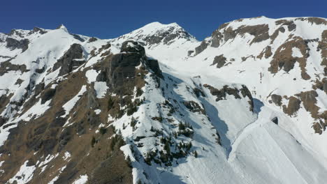 high jib up of snow covered mountain ridge