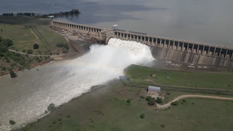 vaal river hydro dam releases flood water, forming rainbow downstream