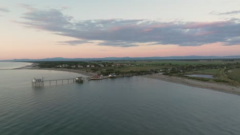 Slow-motion-view-of-typical-fishing-huts-at-sunset-near-Ravenna