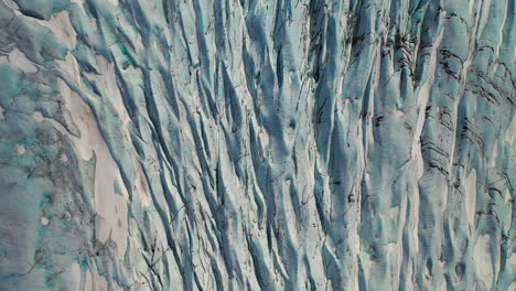 beautiful carvasses of skaftafellsjokull glacier outlet in south iceland. - aerial top drone