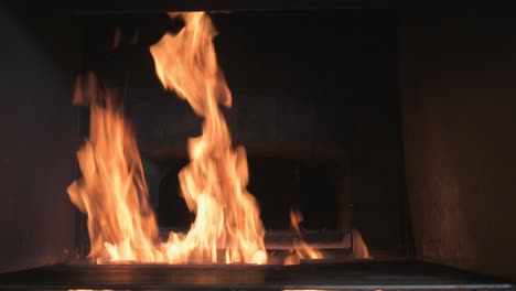 a fire burning in a stone furnace filmed