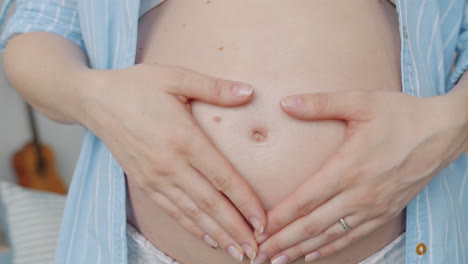 pregnant woman caressing her belly