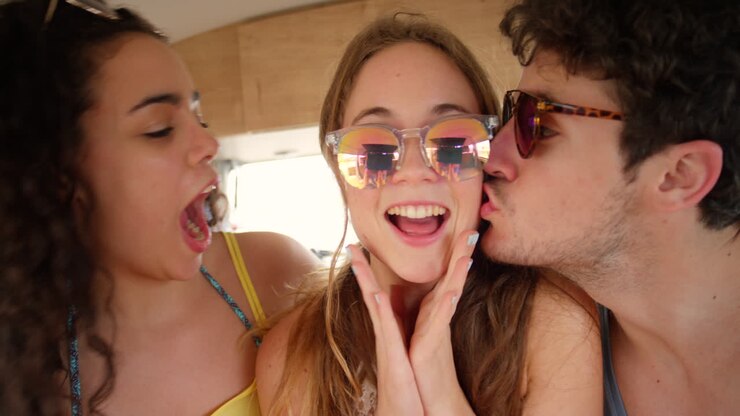 Two happy friends kissing the cheeks
