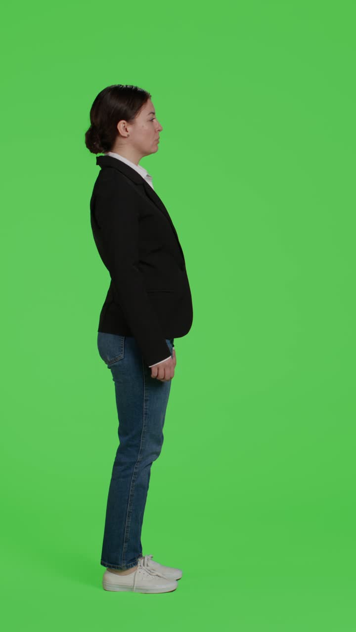 Vertical video: Profile of young businesswoman acting confident wearing suit