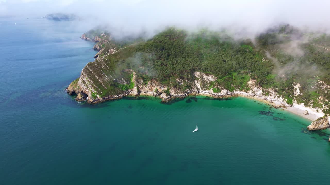 Virgin Island Beach on Crozon Peninsula, secluded beach, turquoise water, and sailboat, Brittany, France. Aerial drone, copy space