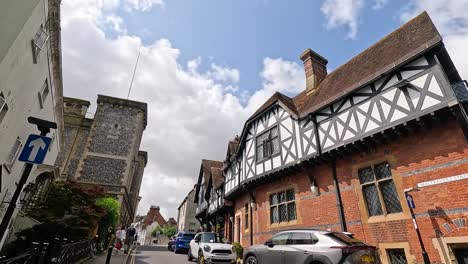 charming street with people and tudor architecture