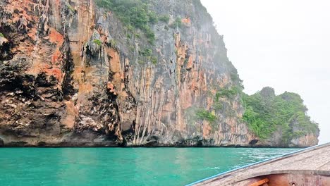 boat travels through scenic ocean and cliffs