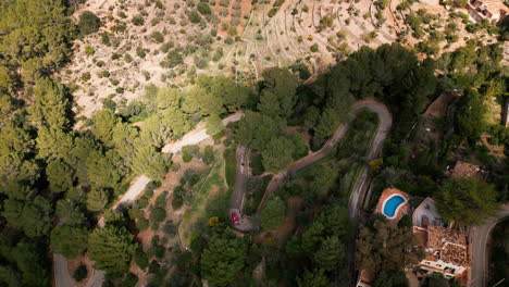 Aerial-view-of-winding-roads-through-Mallorca's-lush-landscape