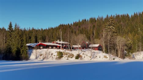 holmenkollen toppsesteret skimore oslo norway norge ski frognerseteren cross country skiing picturesque cabins frognerseteren afternoon arctic golden hour sunset rest stop peaceful static shot