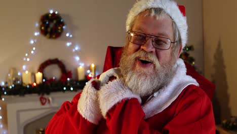 Portrait-of-santa-claus-carrying-sack-with-present