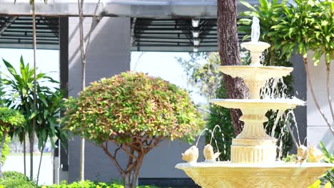 beautiful fountain flowing in lush green park setting