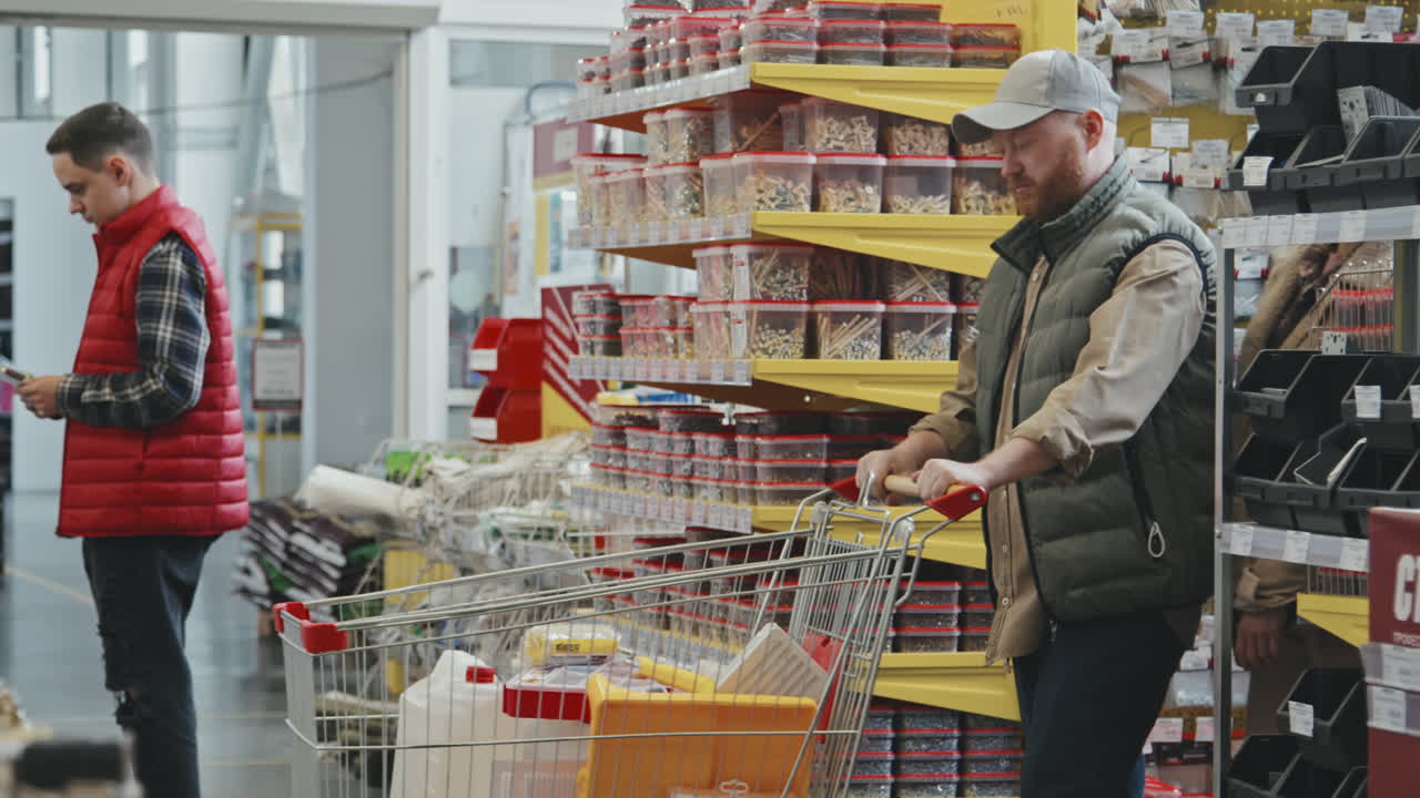 Couple with Cart Shopping at Hardware Store